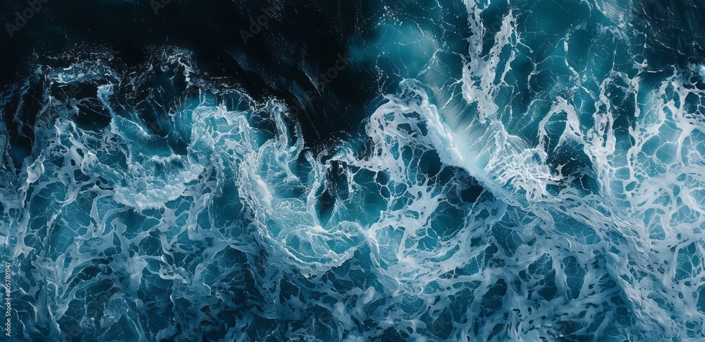 A closeup of the bottom left corner of an ocean wave, capturing its powerful movement and blue hues A closeup of the bottom left corner of an ocean wave, capturing its powerful movement and blue hues