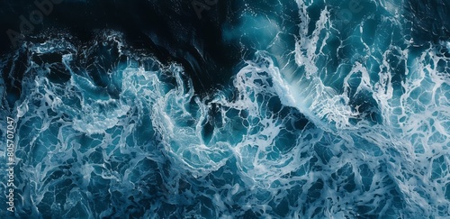 A closeup of the bottom left corner of an ocean wave, capturing its powerful movement and blue hues