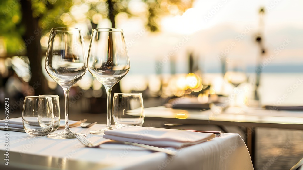 Set table for two person on the seashore. Romantic dating. The tablecloth whispers secrets of love as it gracefully flutters in the ocean breeze, enticing the couple to indulge.