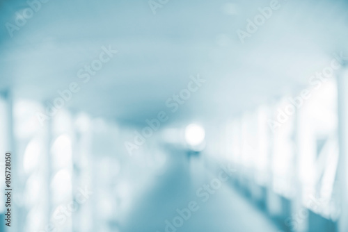 Blurred background hospital healthcare white bokeh with copy space. Blue clean bright blurry background medical laboratory backdrop. Interior lobby simple living space light bokeh. Blurry hallway