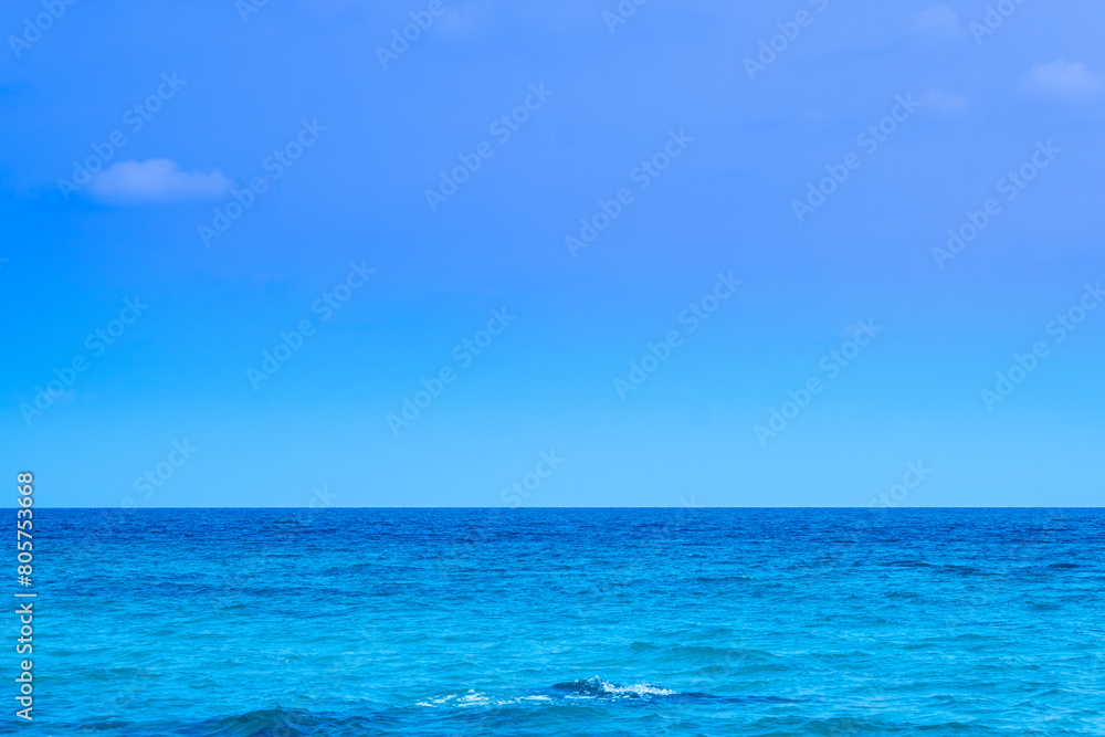 Ocean sea background and the clear sky For summer vacation ideas Nature of summer sea water with sunlight The sea sparkles against the blue sky	
