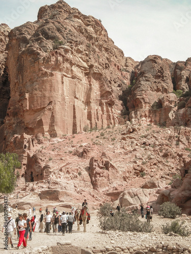 Numerous tourists travel through remains of Nabatean buildings in the Petra historical center in the Wadi Musa city in Jordan