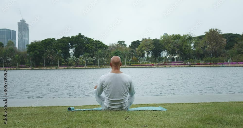 Mature man practice of meditation urban park back view Delves deep state of mindfulness finding peace amidst chaos. Focused breath inner calm restorative power of meditation amidst hustle and bustle. Mature man practice of meditation urban park back view Delves deep state of mindfulness finding peace amidst chaos. Focused breath inner calm restorative power of meditation amidst hustle and bustle.