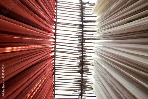 coloured linen hanging to dry in Dye factory, india