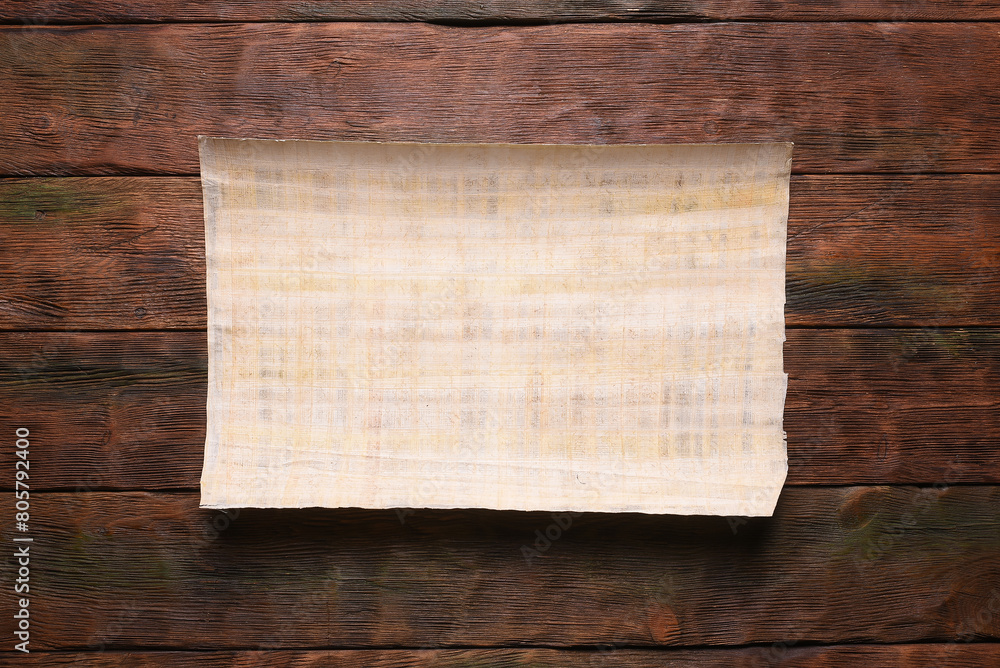 Ancient Egypt papyrus blank letter scroll with copy space on the old flat lay table background. Old map template. Treasure map concept. Ancient Egypt papyrus blank letter scroll with copy space on the old flat lay table background. Old map template. Treasure map concept.
