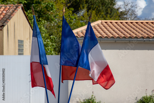 Flags of France three flag waving in french city