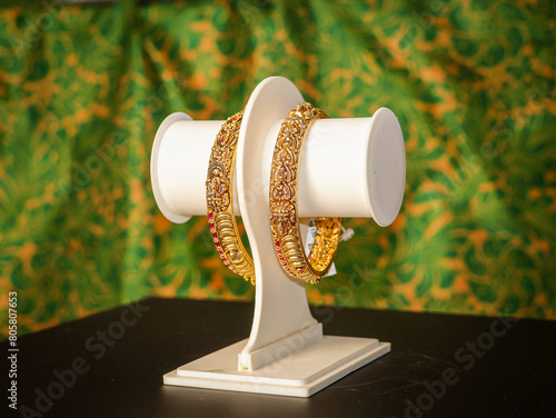Traditional Indian design gold bangle. Fancy designer antique golden Bangles also known as "sone ka Kada" or "sone ka kangan". Indian Temple jewellery exclusive collection with gemstones.