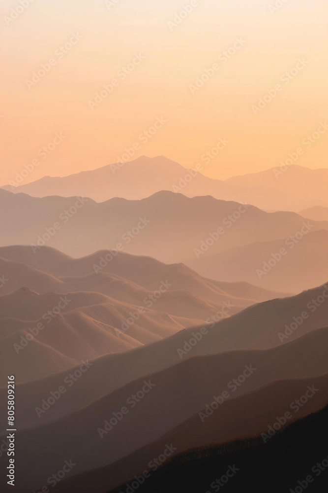 The elongated shadows of mountain ridges cast by the soft light of sunset