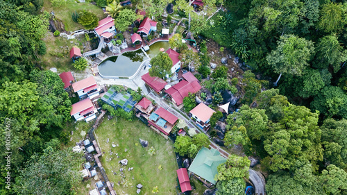Aerial view of the Hill Resort surrounded by the rainforest in Lenggong during sunrise. photo