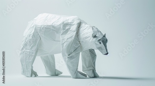 Origami polar bear. Animal made of paper on a white background. Paper folding art.