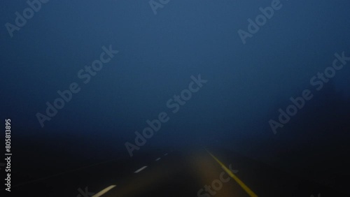 Driving down a country road in thick fog