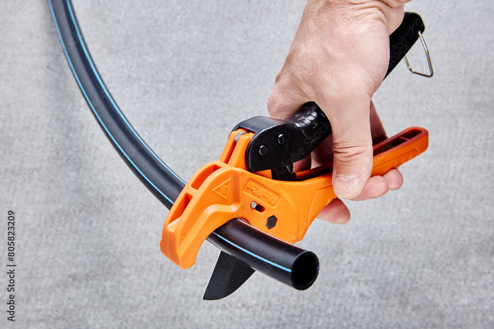 Scissor style cutter for cutting of plastic pipe and tubing. Scissor style cutter for cutting of plastic pipe and tubing.