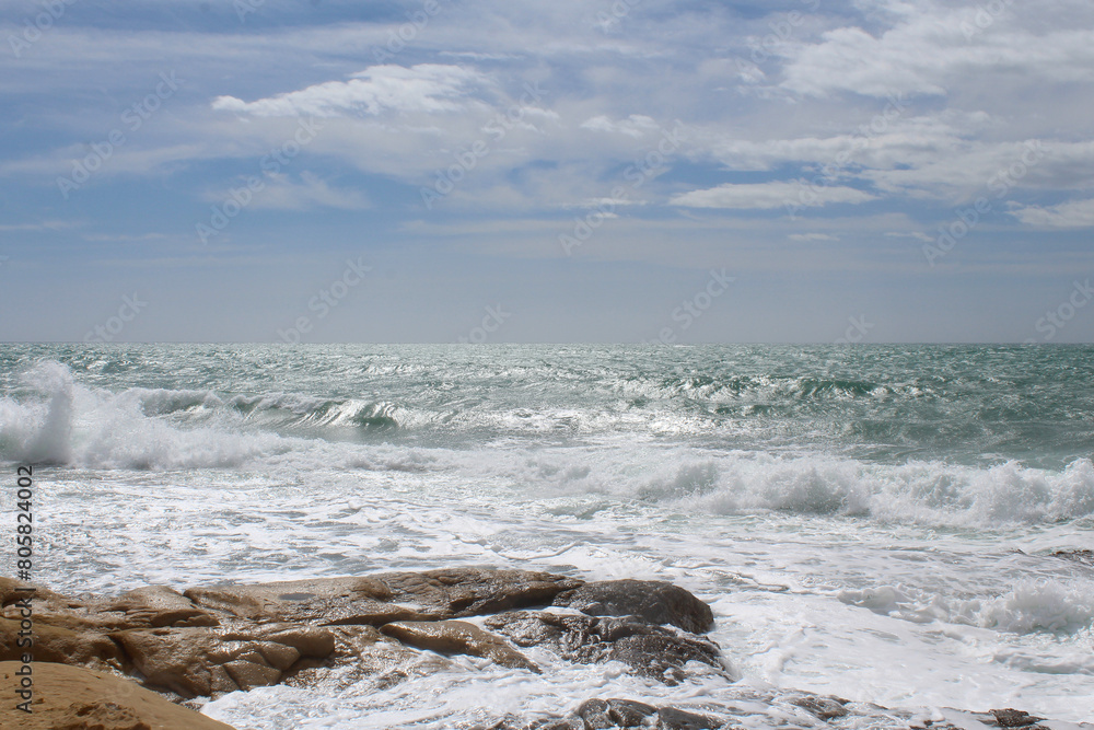 beach and sea,natural background texture sky, sea and stone, Mediterranean coast in Spain, waves on the sea, beach and sea,natural background texture sky, sea and stone, Mediterranean coast in Spain, waves on the sea,