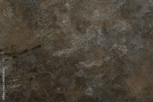 The texture of the surface with signs of wear and scratches.