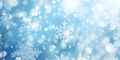 Winter background with falling snowflakes of snow with blur effect