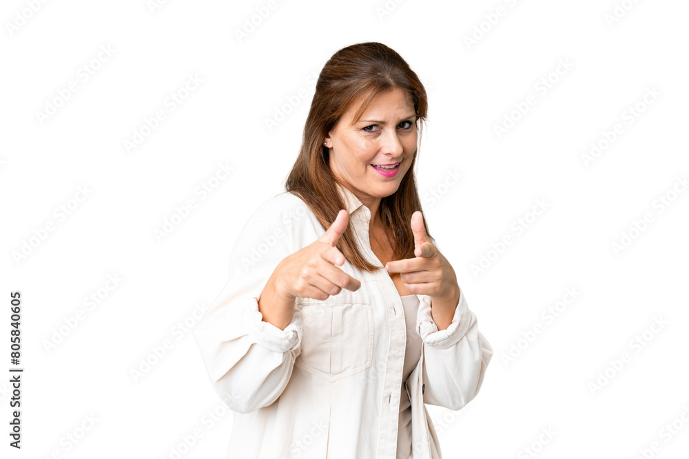 Middle age woman over isolated background pointing to the front and smiling