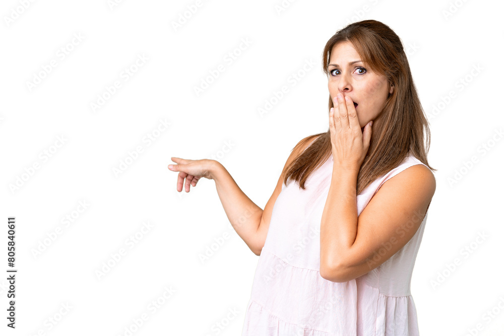Middle age woman over isolated background with surprise expression while pointing side