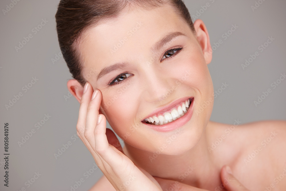Skincare, wellness and portrait of woman in studio for dermatology, cosmetology or facial treatment with gray background. Beauty, smile and female model for healthy skin, makeup or natural glow