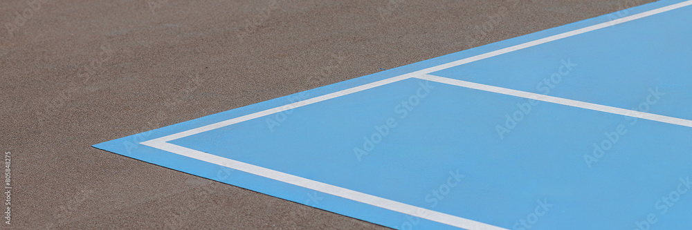A blue and white tennis court with a white line. Banner with copy space.