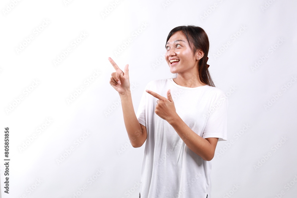 Portrait of smiling young casual lady, asian woman pointing fingers left, showing client info, chart of banner aside on copy space, white background Portrait of smiling young casual lady, asian woman pointing fingers left, showing client info, chart of banner aside on copy space, white background