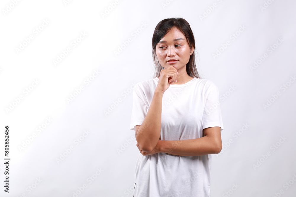 Sad, confused and bored asian woman, looking sideways with lonely and upset expression, standing over white background Sad, confused and bored asian woman, looking sideways with lonely and upset expression, standing over white background