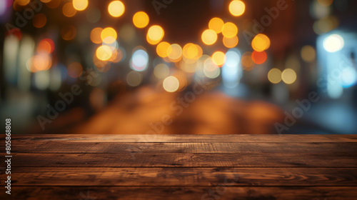 A wooden table with a blurry bokeh background. The table is empty and the background is blurry, giving the impression of a dreamy or surreal atmosphere