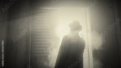 Film noir man looks out from a window with smoke