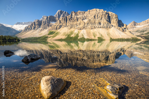 Waputik Range reflecting on Bow Lake, Banff National Park, Alberta Canada photo