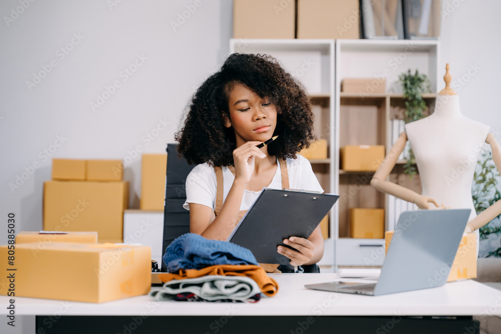 Startup small business SME, Entrepreneur owner woman using smartphone or tablet taking receive and checking online purchase shopping order Startup small business SME, Entrepreneur owner woman using smartphone or tablet taking receive and checking online purchase shopping order