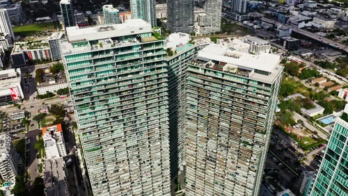 4k aerial footage of skyscrapers. Downtown tourist city of Miami, Florida. Expensive luxury apartments on first line of Biscayne Bay. Urban geometry of american megapolis. Densely populated building