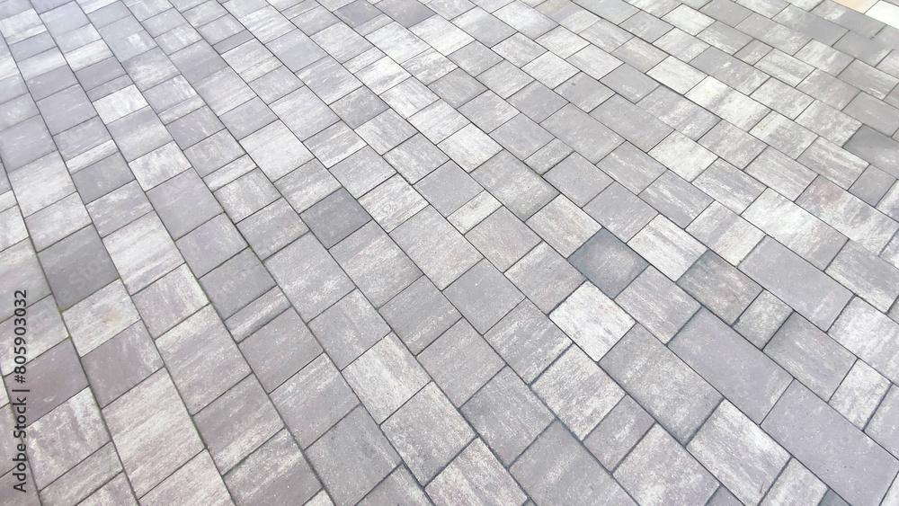 Grey brick wall background close up. Gray stone tile block backgroun Grey brick wall background close up. Gray stone tile block backgroun