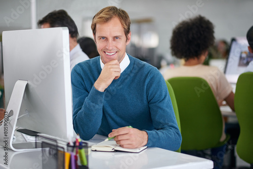 Businessman, happy and office in portrait at desk for work in company with technology in confidence. Pride, employee and finance with broker for action plan with hustle, thinking and workspace