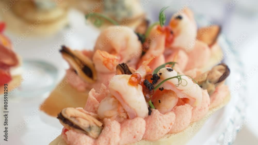 Bruschetta with seafood for the buffet. Toast with caviar oil, shrimps and mussels. Catering for the party. Bruschetta with seafood for the buffet. Toast with caviar oil, shrimps and mussels. Catering for the party.