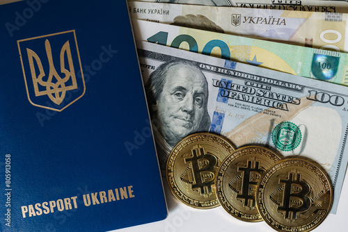 Urkainian passport with golden bitcoins and different banknotes. US dollars and euro cash near the passport. Urkaine currency during the war