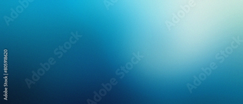 Abstract blurred blue gradient background with grainy and noise texture.