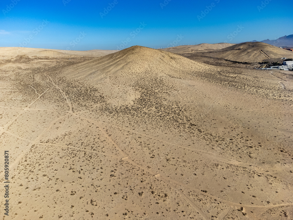 Sandy dunes and hills on Jandia peninsula near Playas de Sotavento en Costa Calma touristic resort, Fuerteventura, Canary islands, Spain