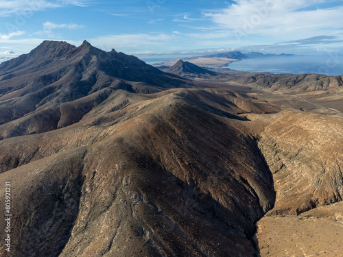 Panoramic view on colourful remote basal hills and mountains of Massif of Betancuria as seen from observation point  Fuerteventura  Canary islands  Spain