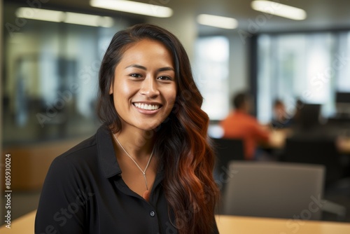 Smiling young professional woman in office