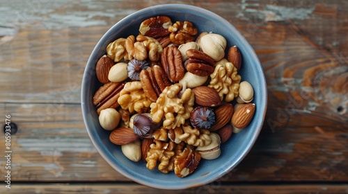  a bowl of mixed nuts, including almonds, walnuts, and pecans, sharply detailed and beautifully centered on a wooden surface.