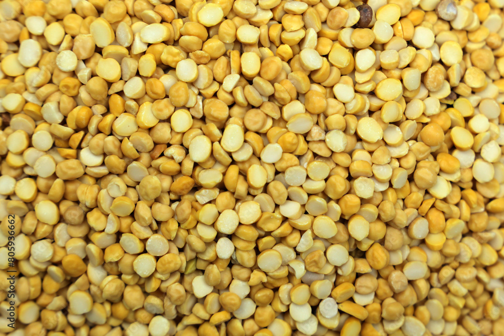 A Close Up of Yellow Chana Daal a Staple Ingredient in Indian Cuisine Against a Neutral Background A Close Up of Yellow Chana Daal a Staple Ingredient in Indian Cuisine Against a Neutral Background