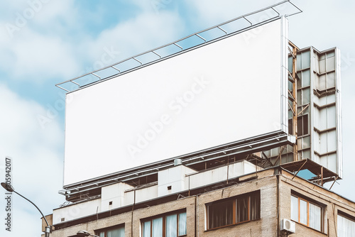 Mock up. Horizontal blank billboard outdoors, outdoor advertising on the top of building