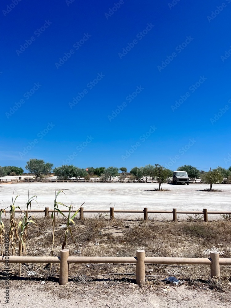 Fototapeta premium empty parking in the desert, summer, blue clear sky