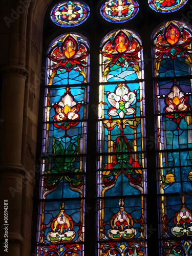 Resplendent Sanctuary, Cathedral's Stained Glass Window Glowing with Vivid Colors Under the Brilliance of Sunlight Peering Through.