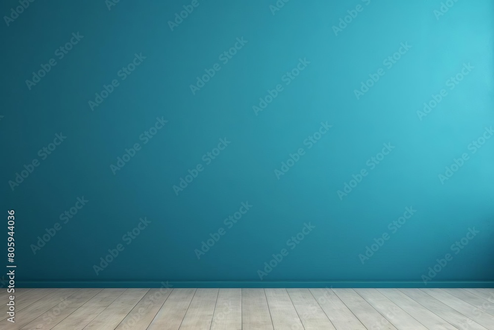 A blue wall with a wooden floor