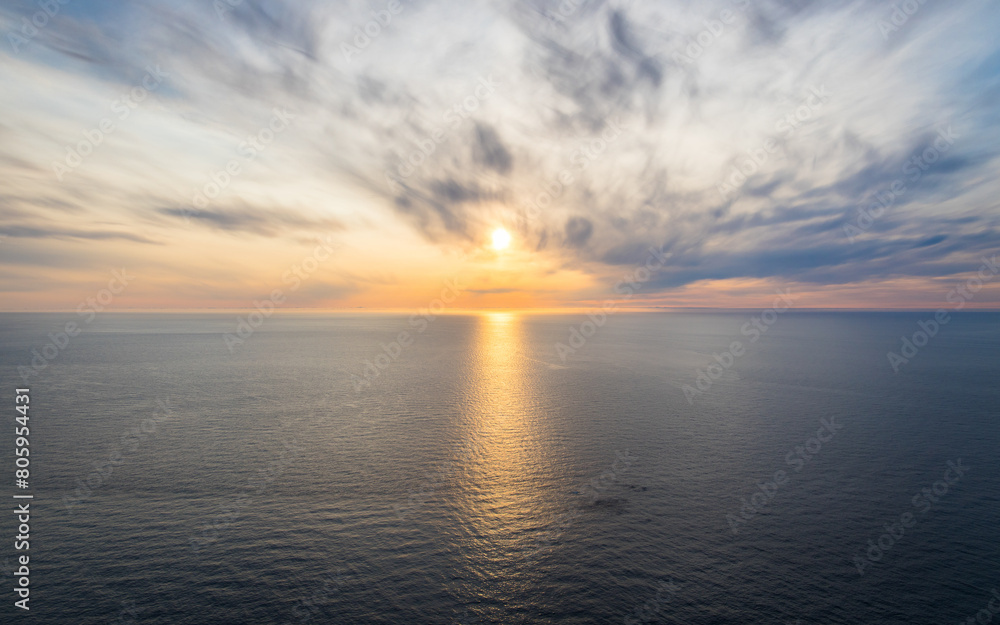 Midsummer sun over the barentsea. Beautiful ocean background. Tranquil scene.