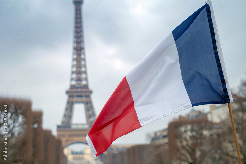 French flag with the Eiffel Tower as a blurred background