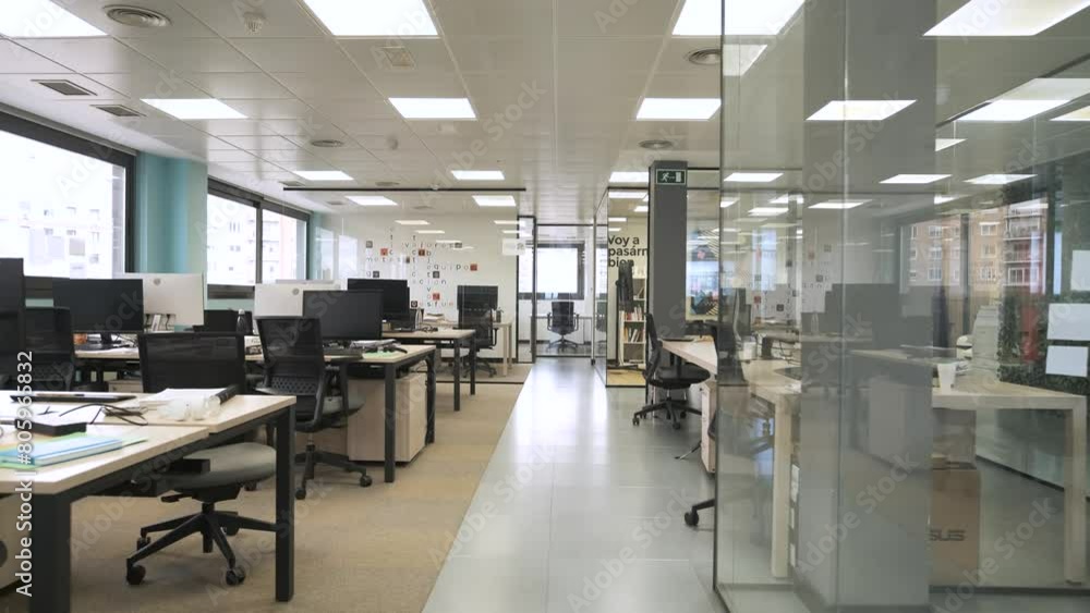 Interior of spacious creative coworking workspace with computer desks Interior of spacious creative coworking workspace with computer desks