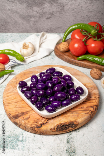 Purple or blueberry olives. Purple olives for breakfast in a plate