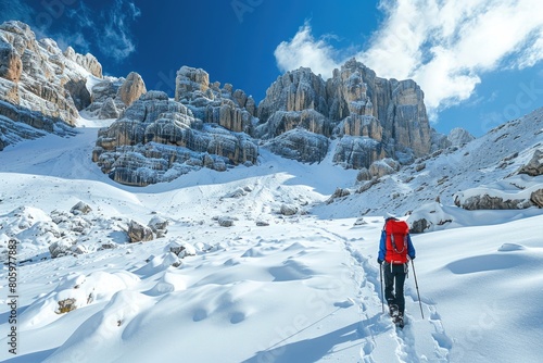 Person Cold. Hiking in Snow near San Pellegrino Pass in Dolomite Alps, Trentino-Alto Adige, Italy photo