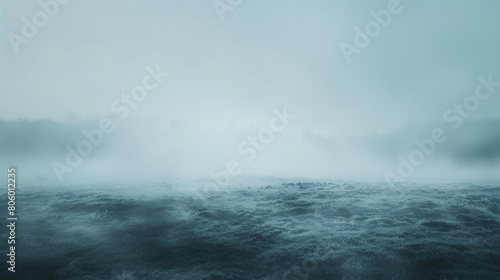 A fog icon enveloping a landscape in mist indicating foggy weather and reduced visibility with thick fog obscuring objects and landmarks in the distance creating an eerie and mysterious  photo